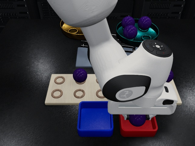 Head camera: one ball in the red tray, the blue tray empty, a hand drawing back