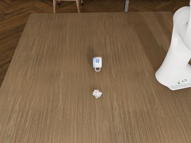 Overhead camera: the table from above, the mug and the crumpled napkin on it