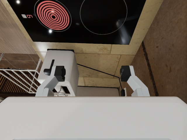 Wrist camera: the glowing ring beyond the fingers, the airer's white rails to the right