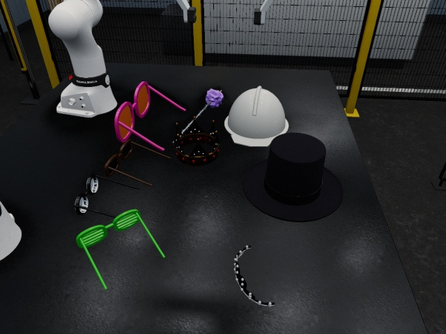 Side camera: the party table with hats, glasses and the purple wand, the two arms at rest